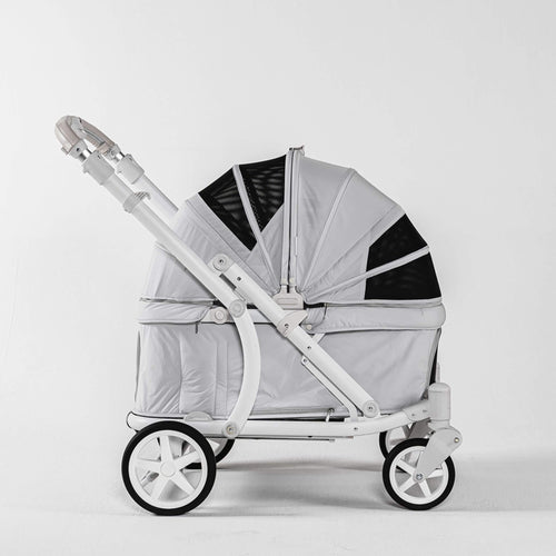A light gray and white stroller with black mesh accents, shown from a side profile against a clean white studio background.
