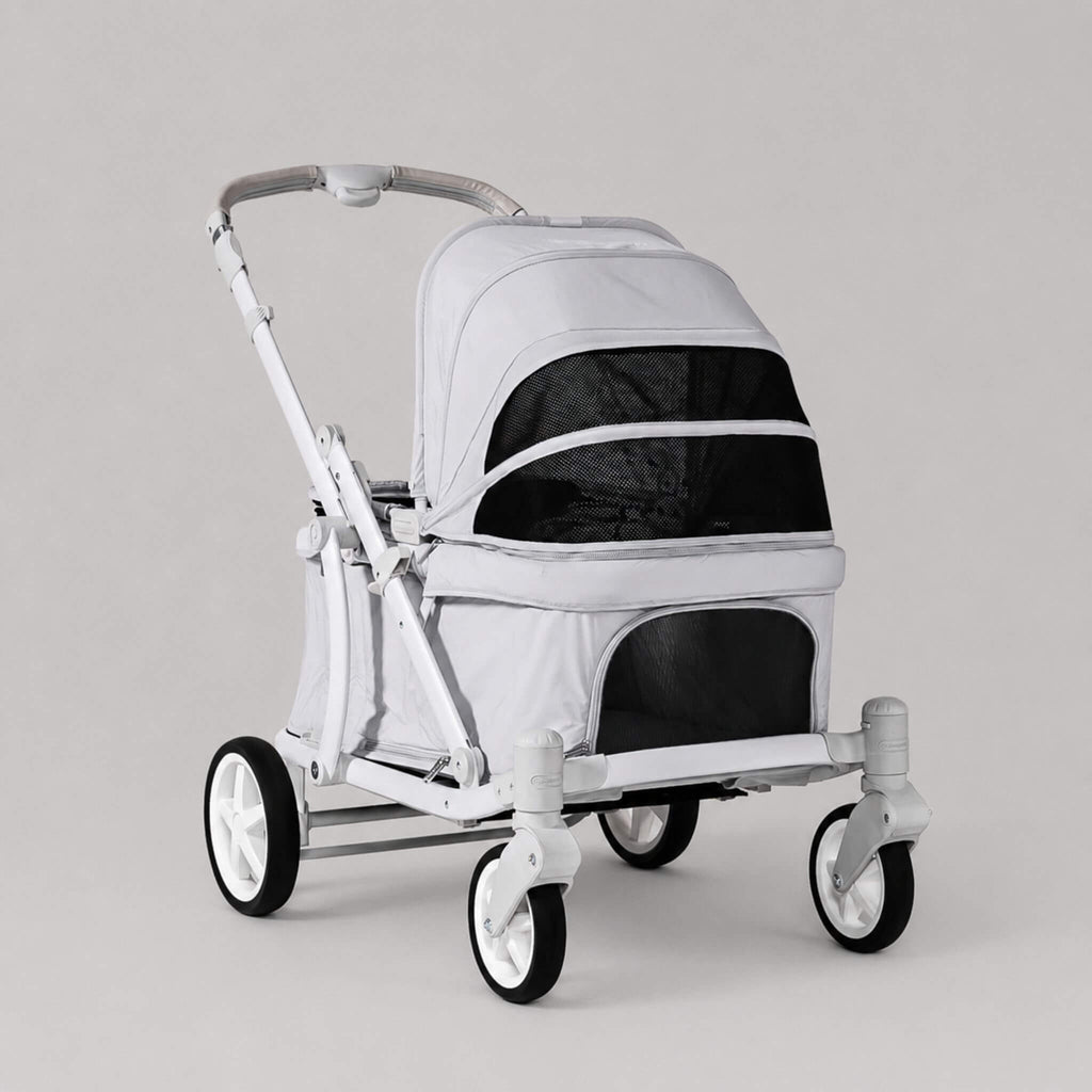 A light gray and white pet stroller with black mesh windows, shown on a clean, light gray studio background.